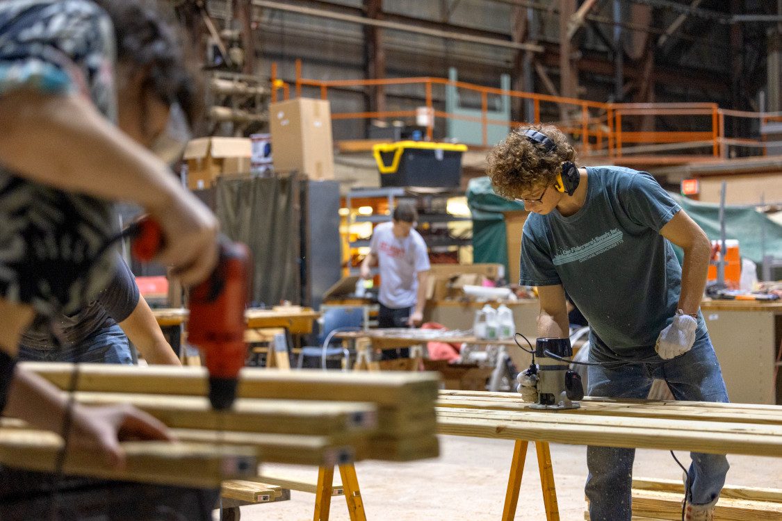 Current students in the American Society of Civil Engineers work in Cornell's High Voltage Lab on Mitchell Street to build new parts for the Flat Rock Bridge. The student chapter of the American Society of Civil Engineers (ASCE) built the Flat Rock pedestrian bridge in 1983 - now the current ASCE students are working to renovate it for the next 40 years, with the help of alumni from the class of '83, retired and current faculty from the department of civil and environmental engineering, and the local Ithaca ASCE chapter.