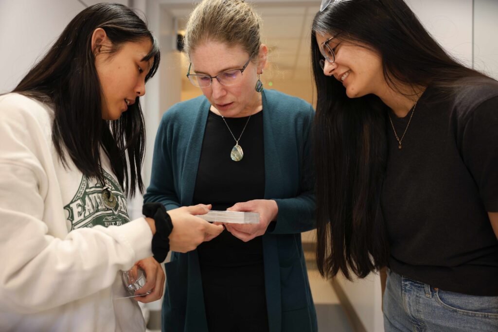 Lara Estroff and two students