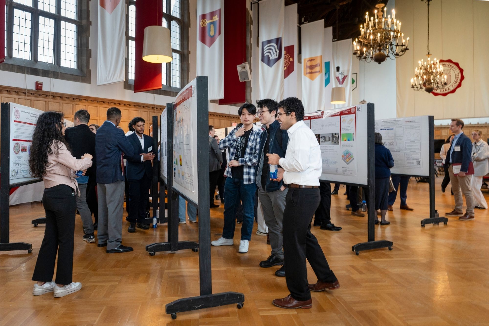 Students presenting their research during a poster session at the 2025 Distinguished Awards Gala