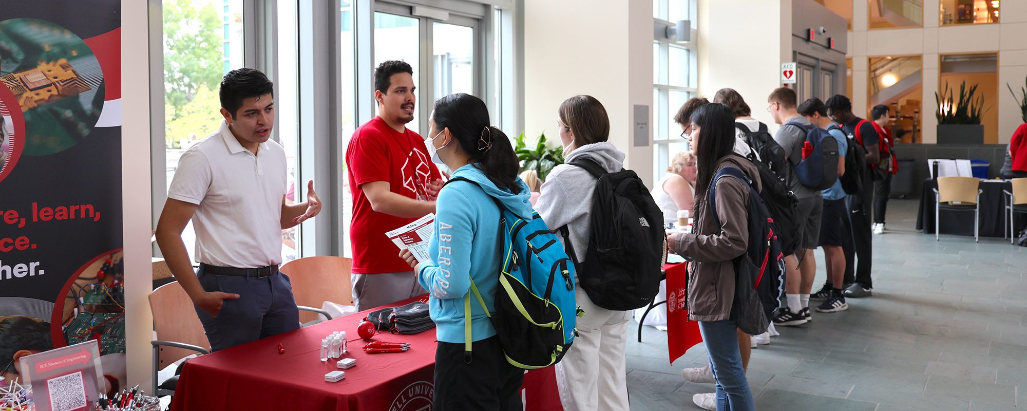 Students lining up to speak to representatives of the Cornell M.Eng. programs in Duffield Hall