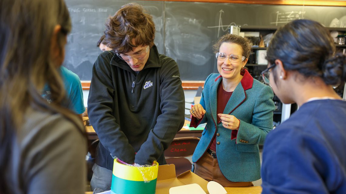 Allison godwin smiles as she instructs three students