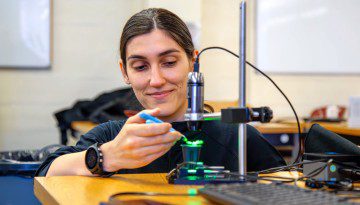 researcher uses a tabletop device