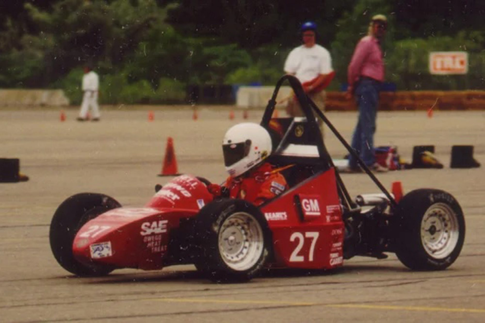 Historic image of racing car and racer from Cornell Racing