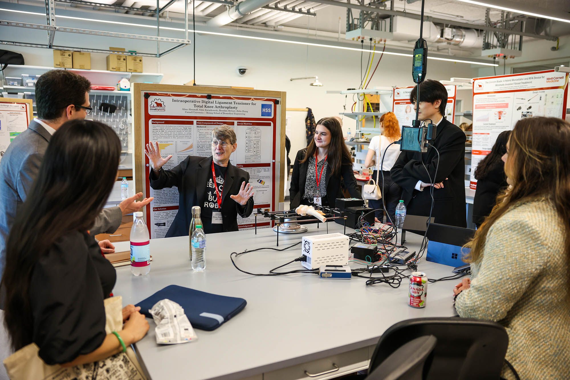 Group of students show a biomedical engineering project at a lab during industry showcase