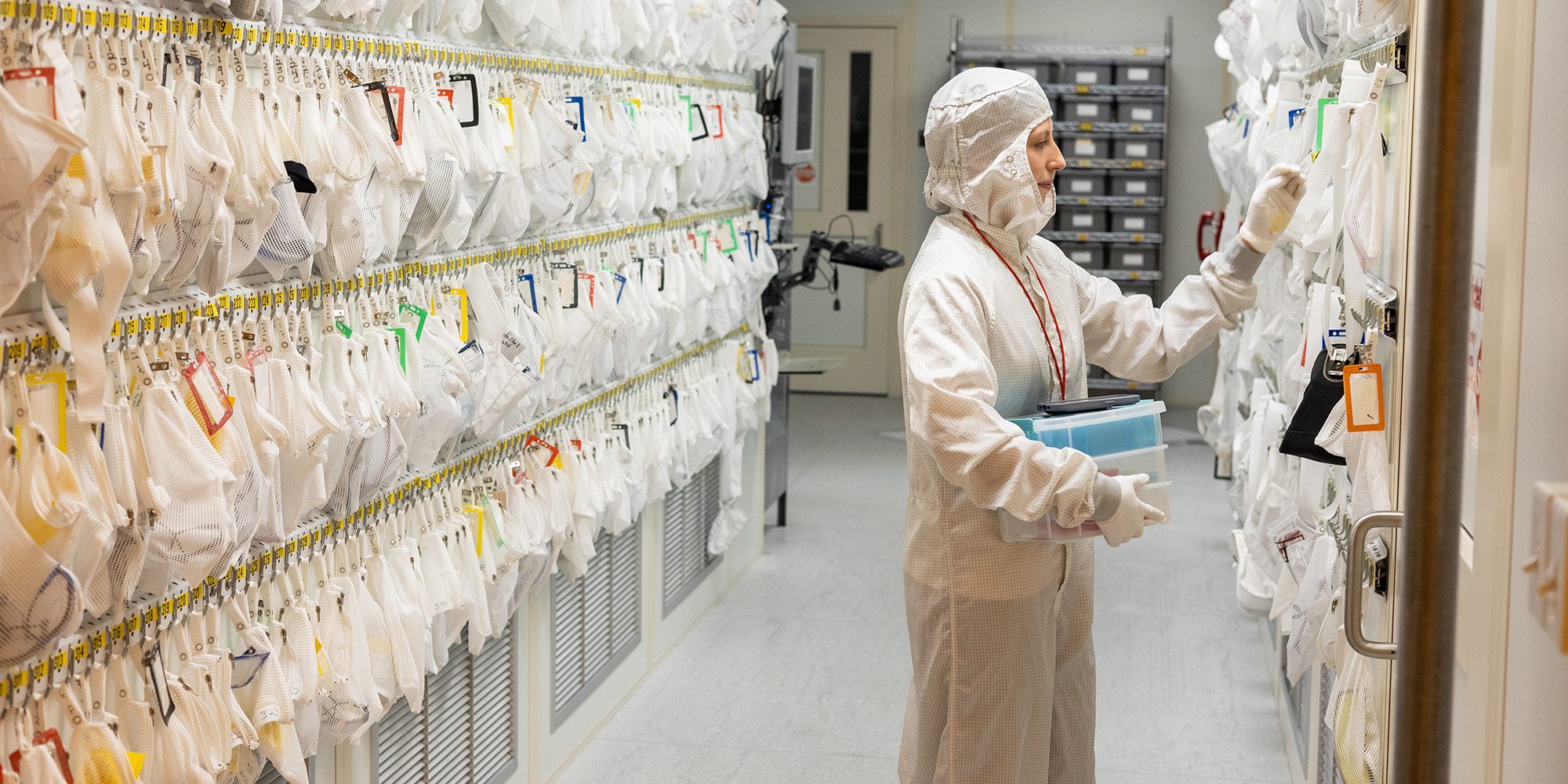 Aloyse, an undergraduate student, gathers supplies in the Cornell Nanoscale Facility clean room.