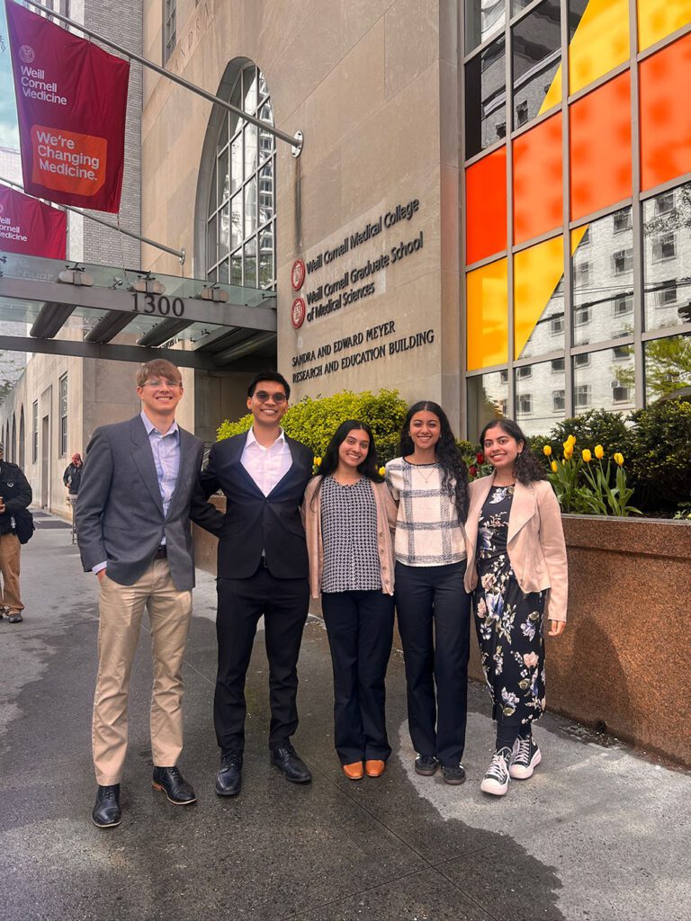 Marcus Gamboa with his four senior design team members outside Weill Cornell Medicine in New York City.