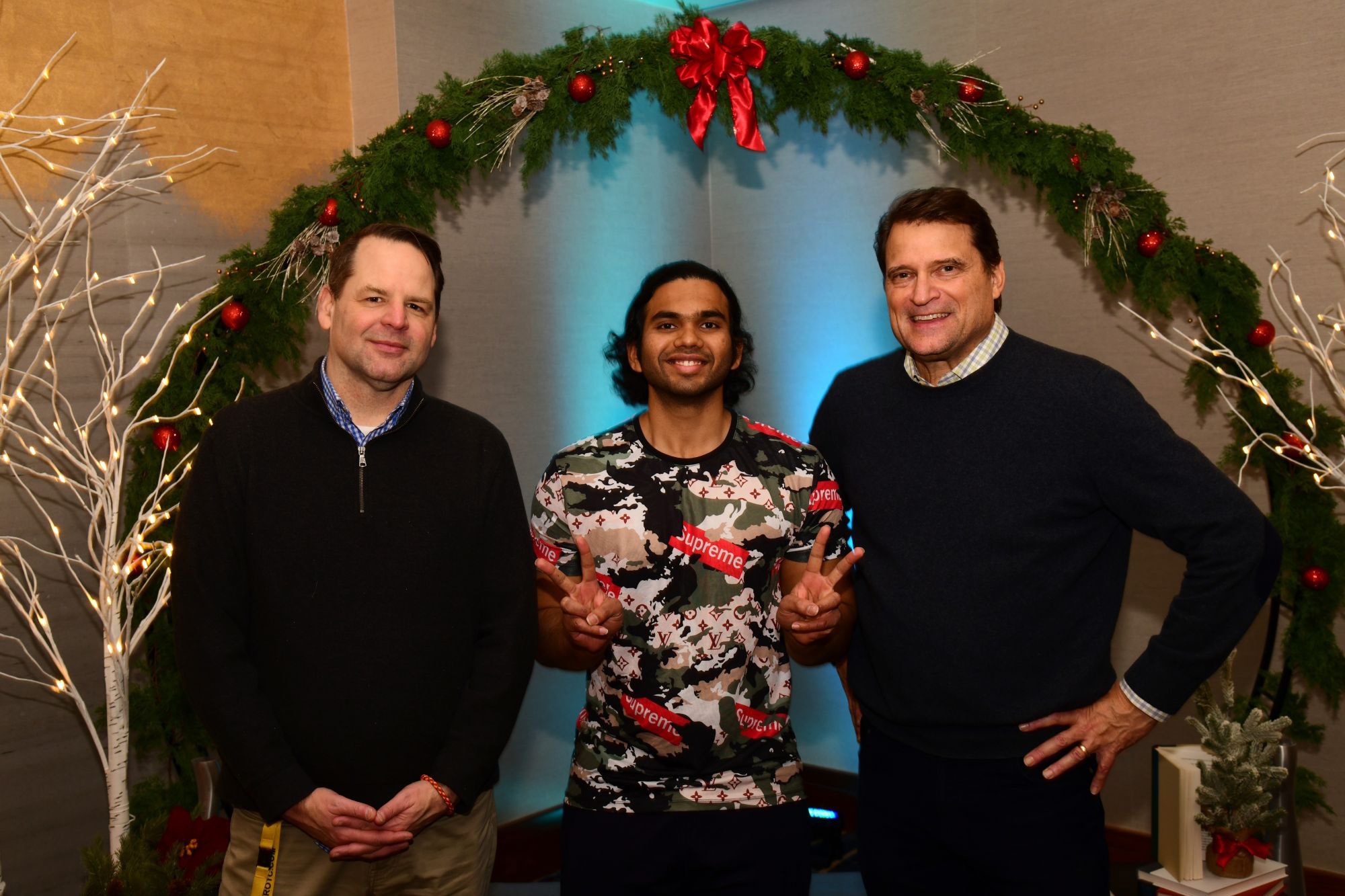 CBE M.Eng. Student Siddhant Dhende stands with mentors Jeff Varner and Brian Bauer at holiday party.