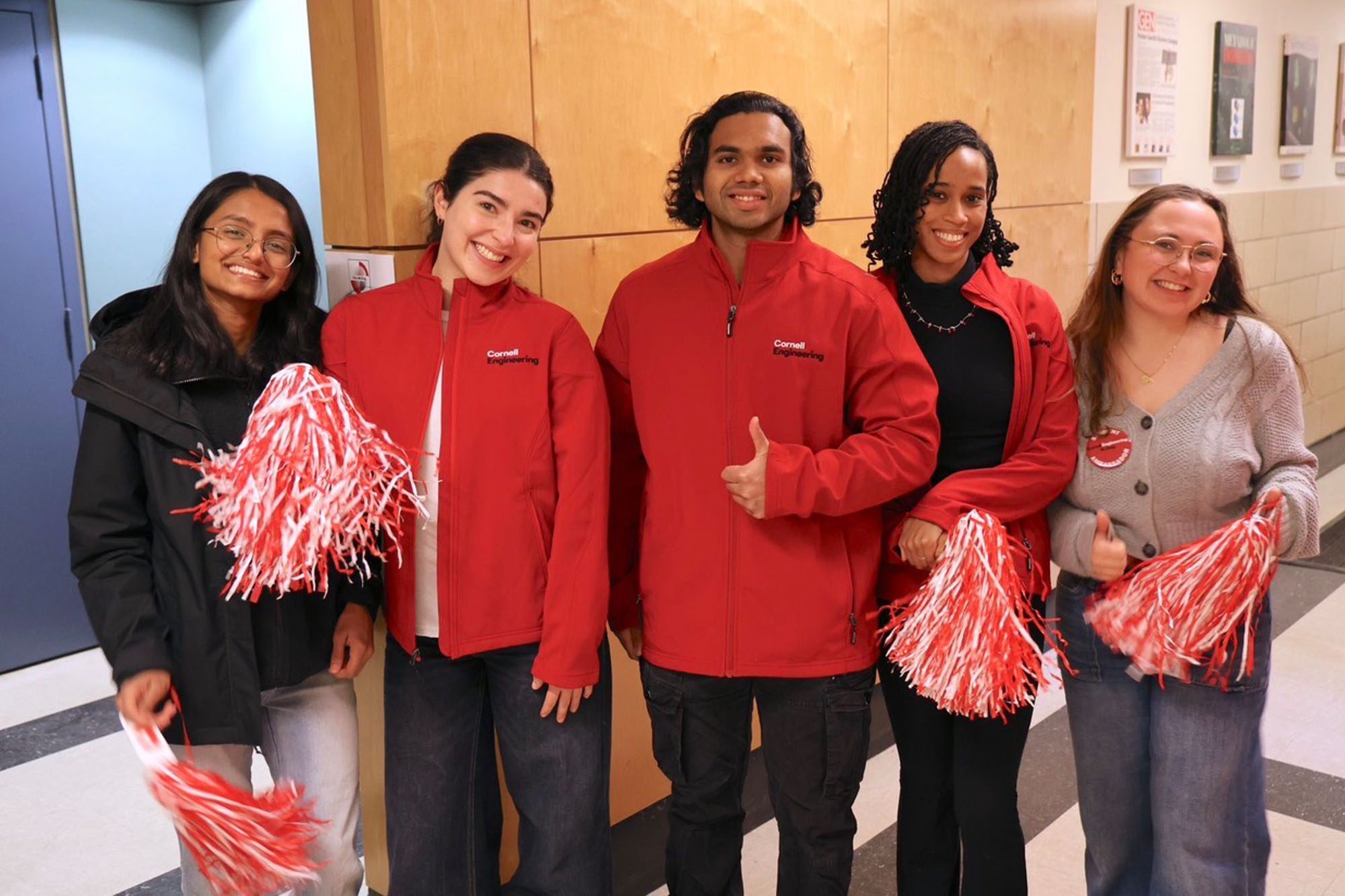 CBE M.Eng. Student Siddhant Dhende with fellow unibuddy students and pom-poms.