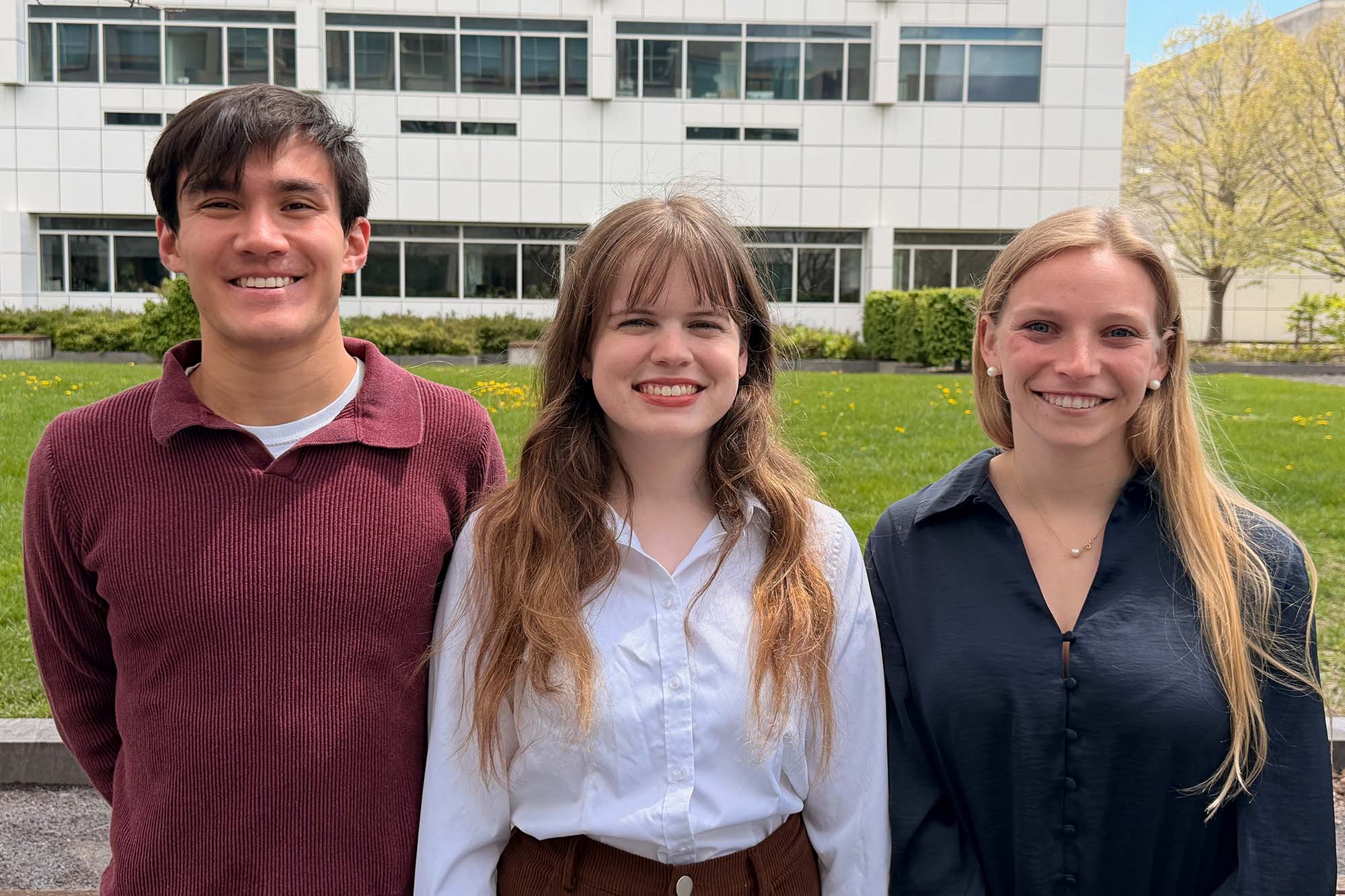 Biomedical engineering NSF GRFP undergraduate awardees stand together outside Weill Hall. Ryan Lyppens, Ella Sultan, and Alexandra Griffin.