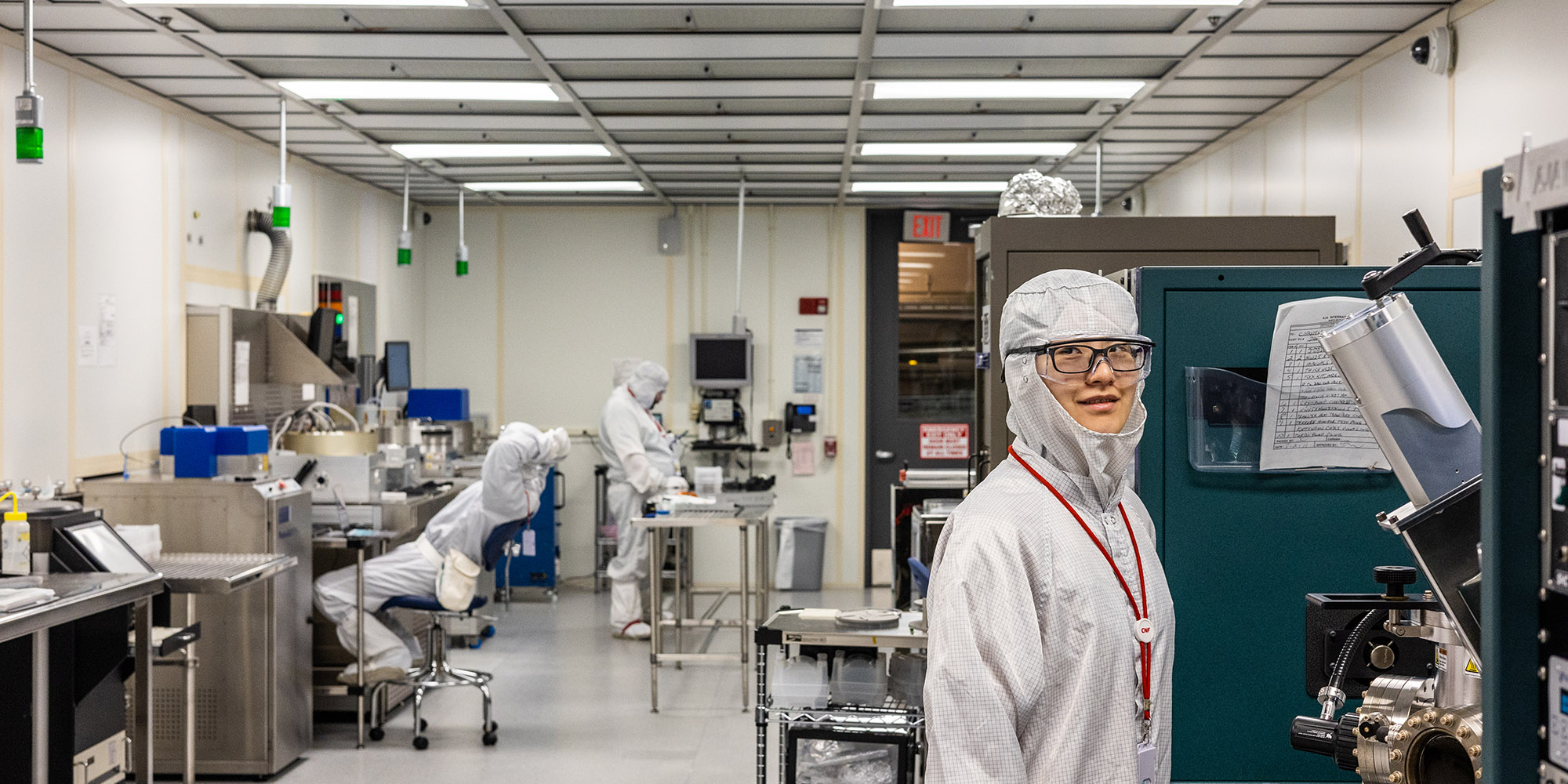 Duffield undergraduate students working on research in the CNF clean room facility