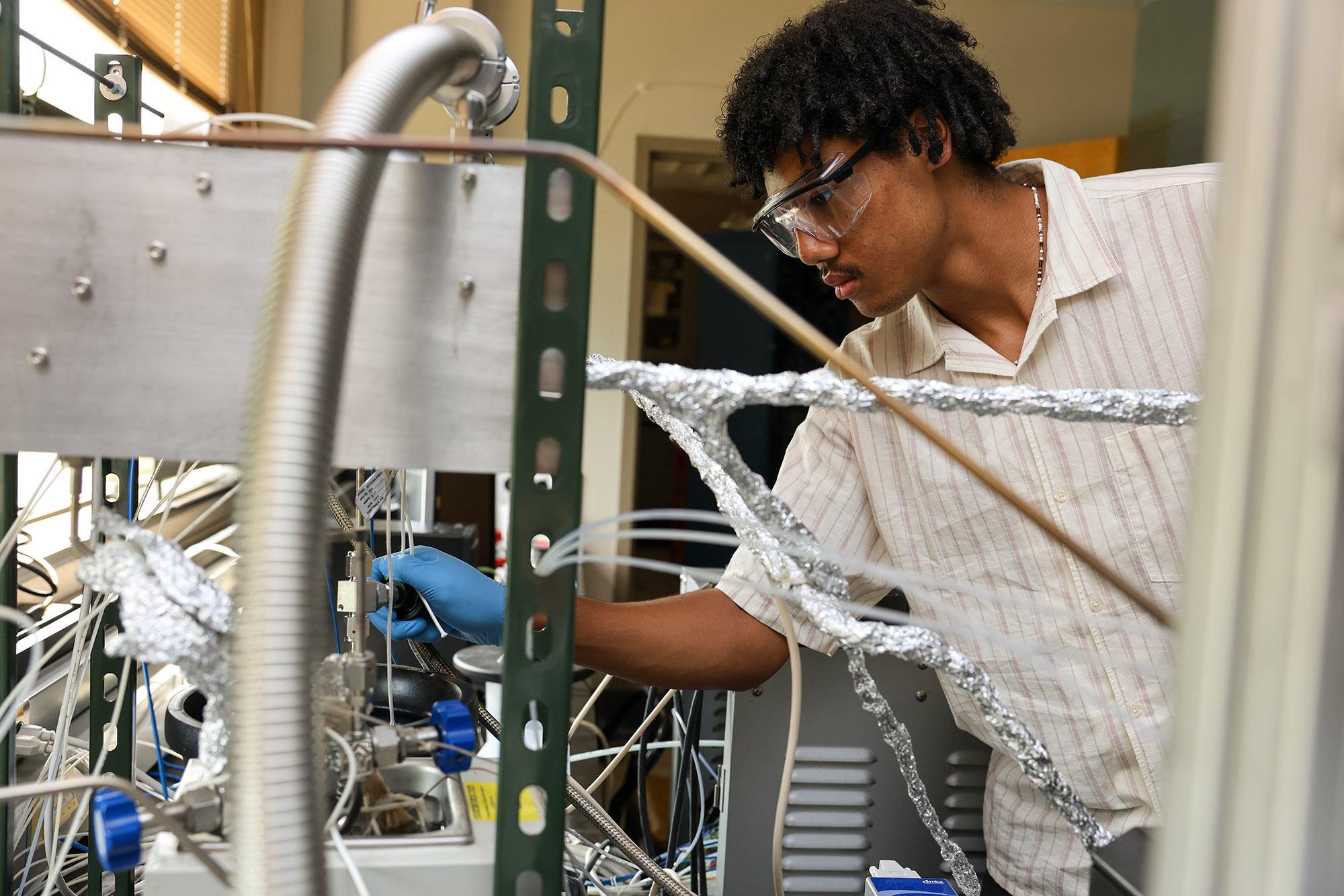 Office of Inclusive Excellence Scholar working in a lab