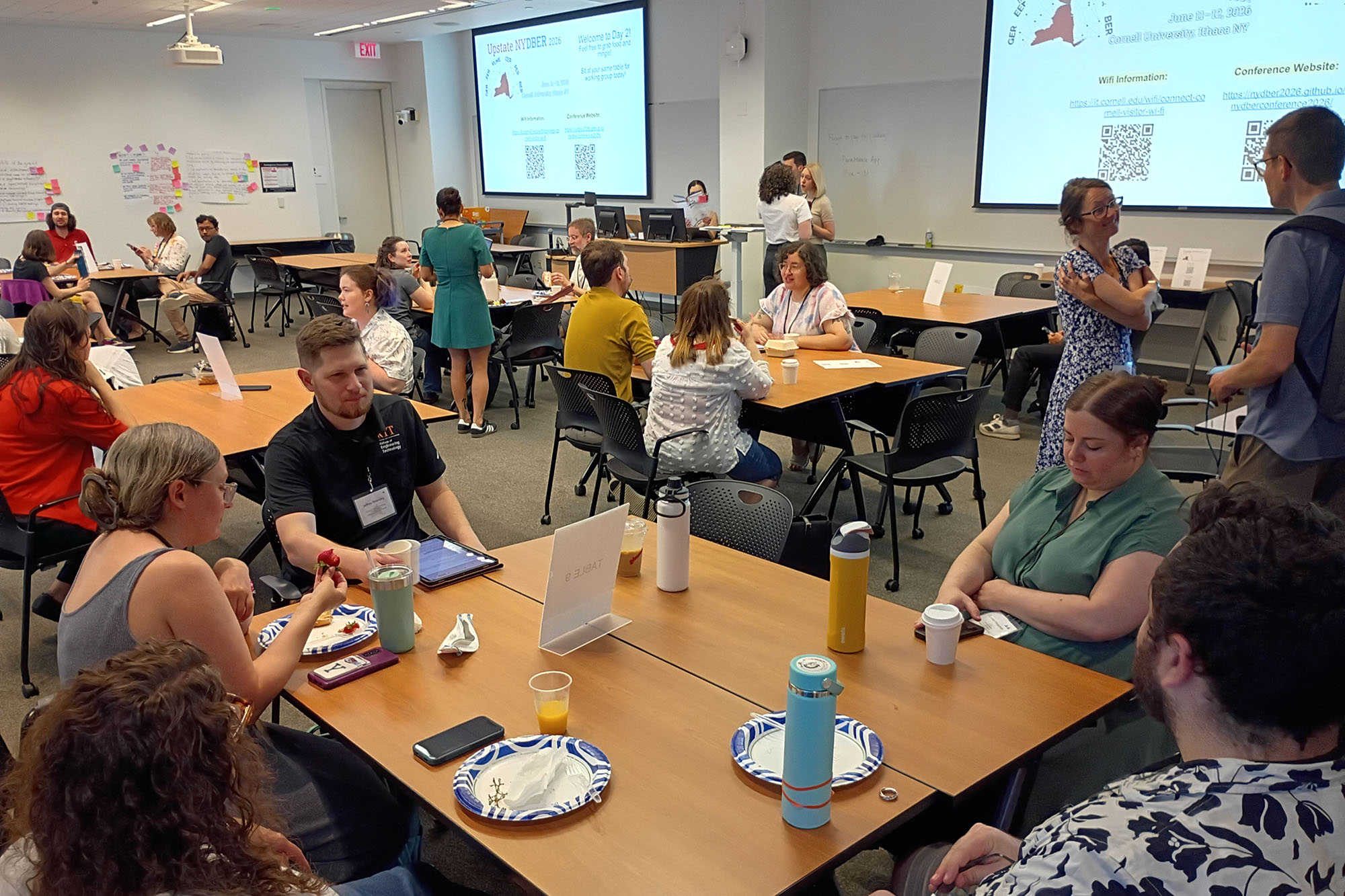 Participants network at tables in a Weill Hall classroom at the NYDBER meeting in Weill Hall, June 2026.