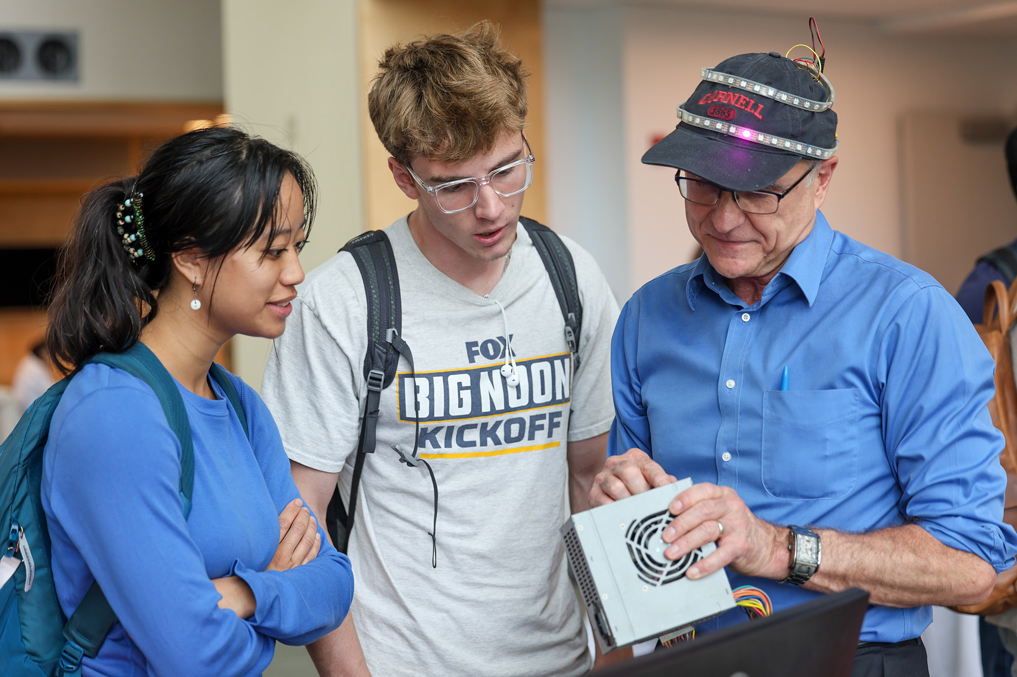 Joe Skovira talking to student at the M.Eng. Expo