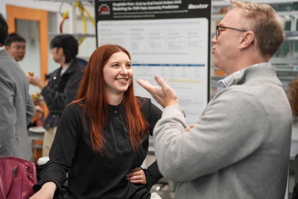 Diana Rudz, M.Eng. '16, talks with professor Jonathan Butcher at the annual Meinig School Industry Day