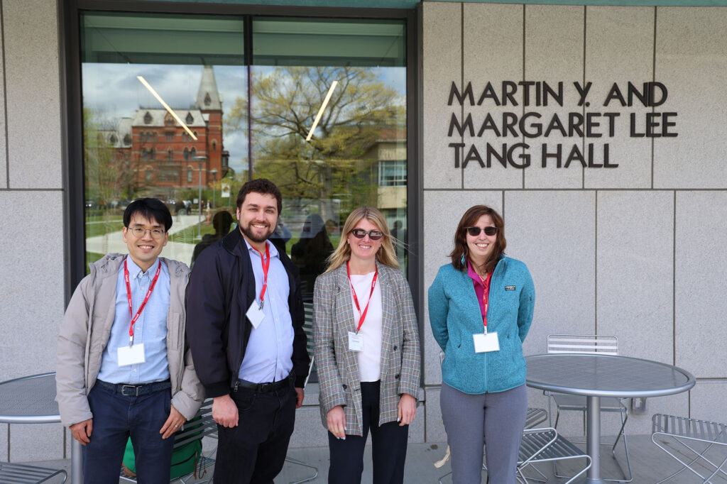 Michelle Walther with fellow M.Eng. ’16 alums Dae Hee Yun, Joe Maher, and Emily Christie, standing together outside Tang Hall at M.Eng. Industry Day on May 15, 2026.